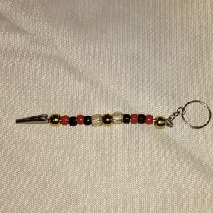 Red, black and gold roach clip keychain